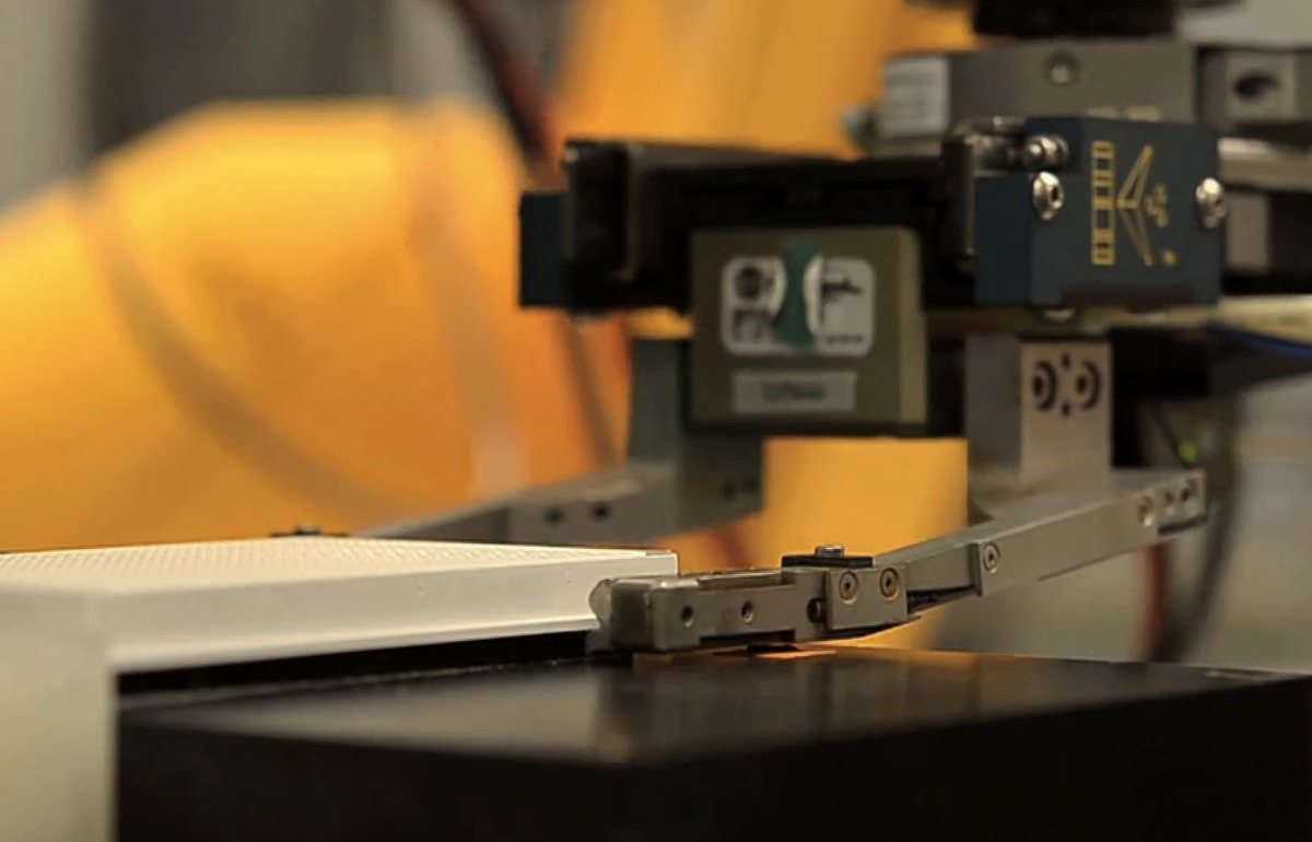 Robot gripper placing a plate, from the wrist camera